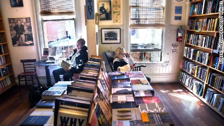 Customers peruse books in the Poetry Room at City Lights Bookstore in San Francisco, California. 