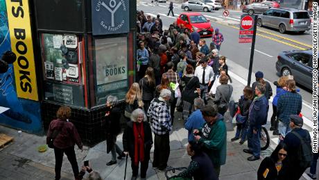 Hundreds of people outside City Lights Bookstore on Sunday, March 24, 2019, in San Francisco, Calif. Lawrence Ferlinghetti was celebrated on his 100th birthday. 