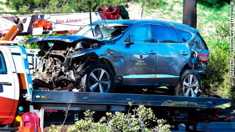 A tow truck picks up the vehicle driven by golfer Tiger Woods in Rancho Palos Verdes, California, after a rollover accident.