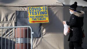 NEW YORK, NEW YORK - DECEMBER 15: People walk by a Brooklyn hospital offering COVID-19 testing that has seen a rise in coronavirus-related cases on December 15, 2020 in New York City. After closing indoor dining earlier this week, New York City politicians are warning of another city-wide lockdown as COVID-19 cases are on the rise again. Last week in New York, over 200 suspected COVID-19 patients were admitted per day, bringing some hospitals to near capacity. (Photo by Spencer Platt/Getty Images)
