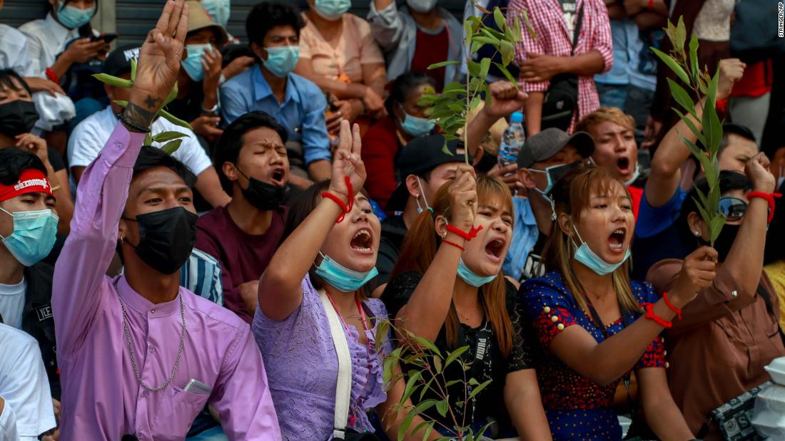 Anti-coup protesters shout slogans in Yangon on February 25.