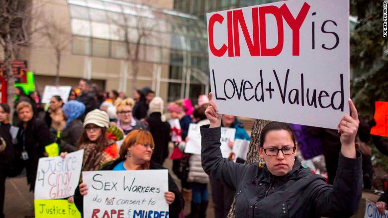 Protesters hold signs in support of Cindy Gladue outside Edmonton's city hall on April 2, 2015. 