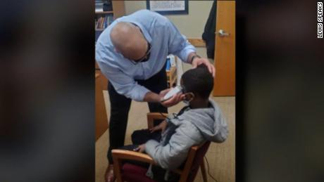 A middle schooler was insecure about his haircut. So his principal fixed it himself instead of disciplining the boy for wearing a hat 
