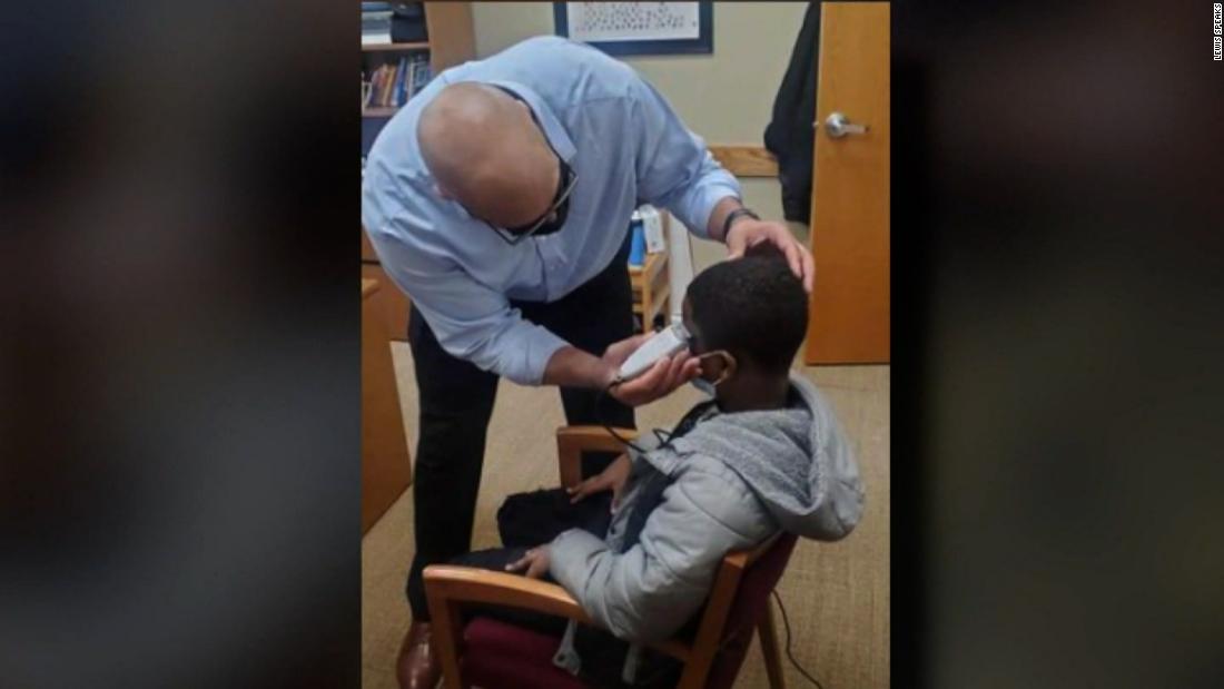 A high school student was unsure about his haircut.  Instead of disciplining him for wearing a hat, the director fixed it himself