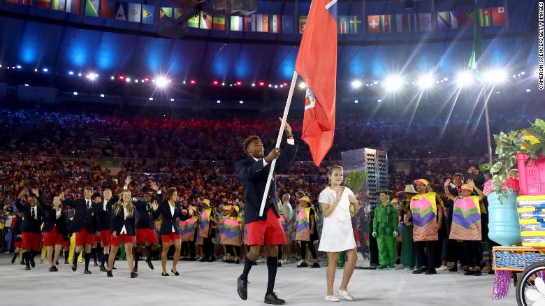 Tyrone Smith carries the flag for Bermuda during the opening ceremony of the Rio 2016 Olympics.