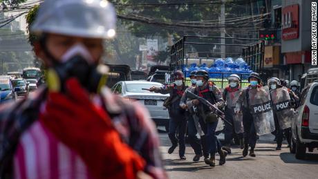 Riot police charge at anti-coup protesters on February 27, 2021 in Yangon, Myanmar. 