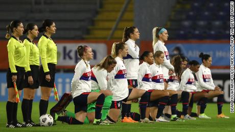 US players kneel before a friendly against the Netherlands in November.