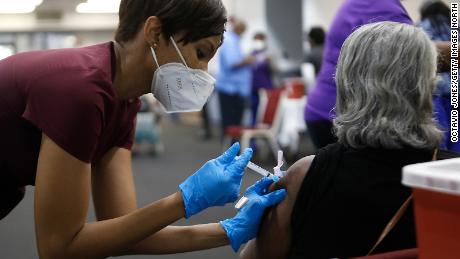 A health care worker administers the Moderna Covid-19 vaccine at the Bible-Based Fellowship Church on February 13 in Tampa, Florida.