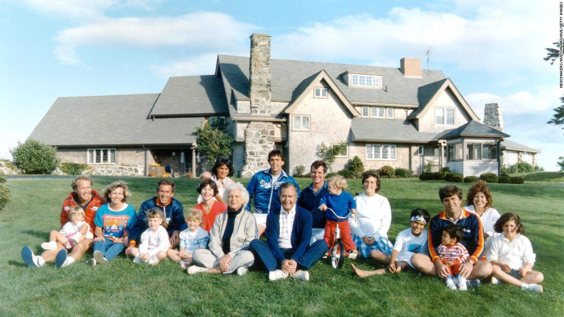 Members of the Bush family pose for a 1986 photo in Kennebunkport, Maine. George W. Bush is third from left behind his young daughter Barbara.