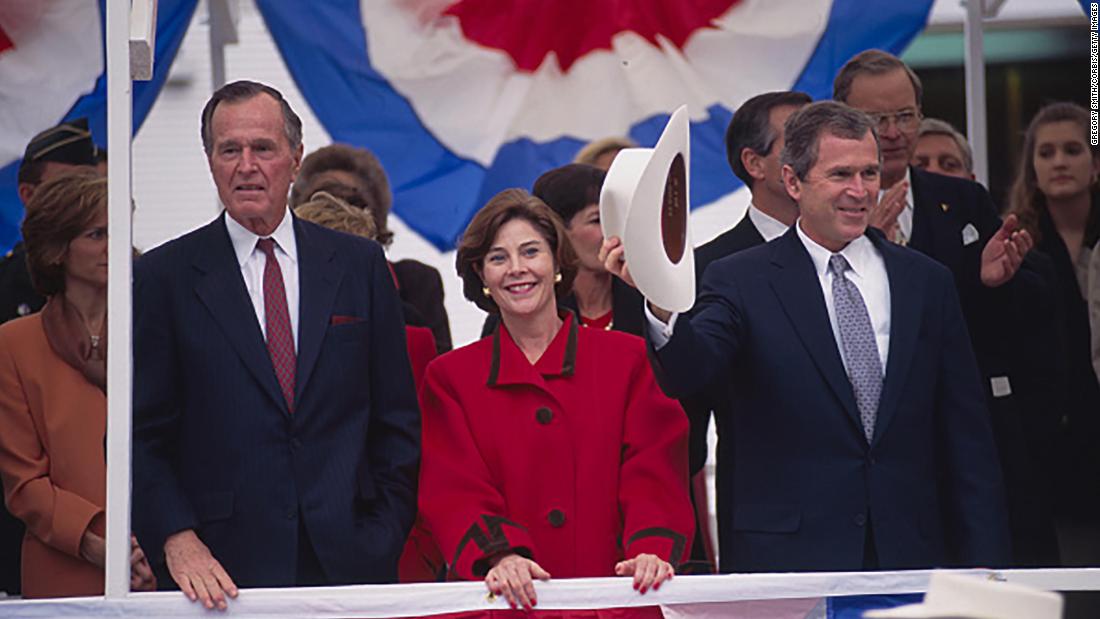 Bush&#39;s father joins him and Laura at his inauguration in Texas in 1994. Bush went on to win a second term in 1998 before running for president.