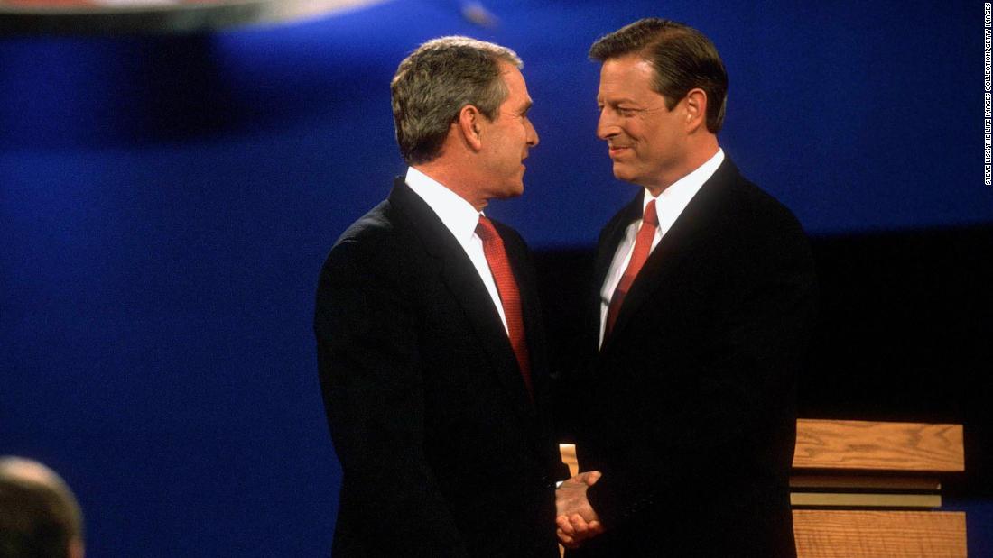 Bush shakes hands with his Democratic opponent, Vice President Al Gore, at their first presidential debate in October 2000.