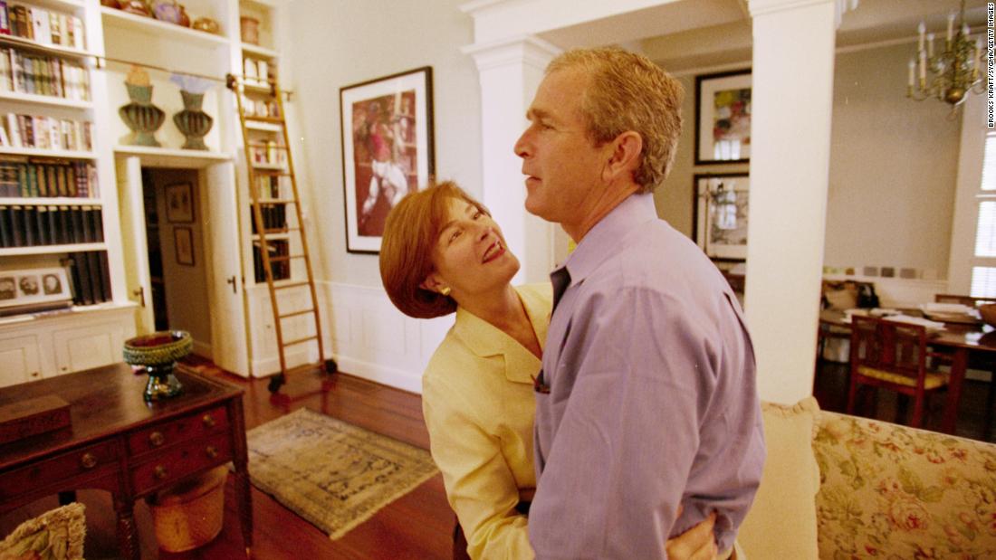 Bush is embraced by his wife, Laura, at the governor&#39;s mansion in November 2000. Bush lost the popular vote but edged Gore in the Electoral College. His victory didn&#39;t become official until December, when the US Supreme Court, by a 5-4 margin, suspended a recount in the deciding state of Florida. Gore conceded the next day.