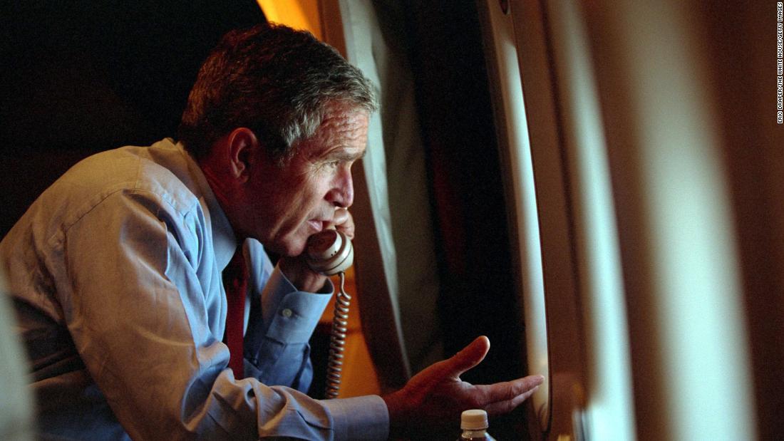 Bush, aboard Air Force One, talks on the phone with Vice President Dick Cheney on September 11, 2001.