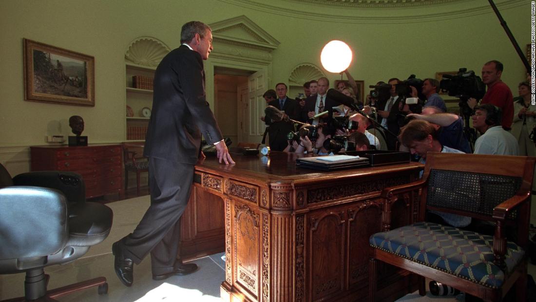 Bush addresses the media in the White House Oval Office after a telephone call with New York Gov. George Pataki and New York City Mayor Rudy Giuliani on September 13, 2001.