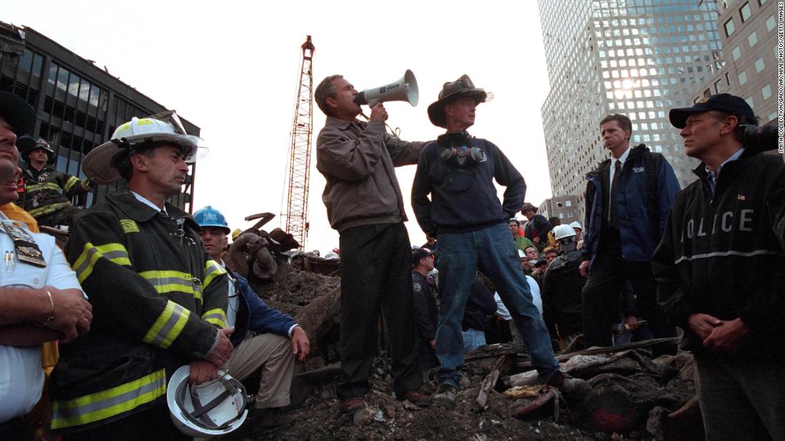 Bush speaks to rescue workers, firefighters and police officers at the rubble of New York&#39;s ground zero, three days after the September 11 attacks.