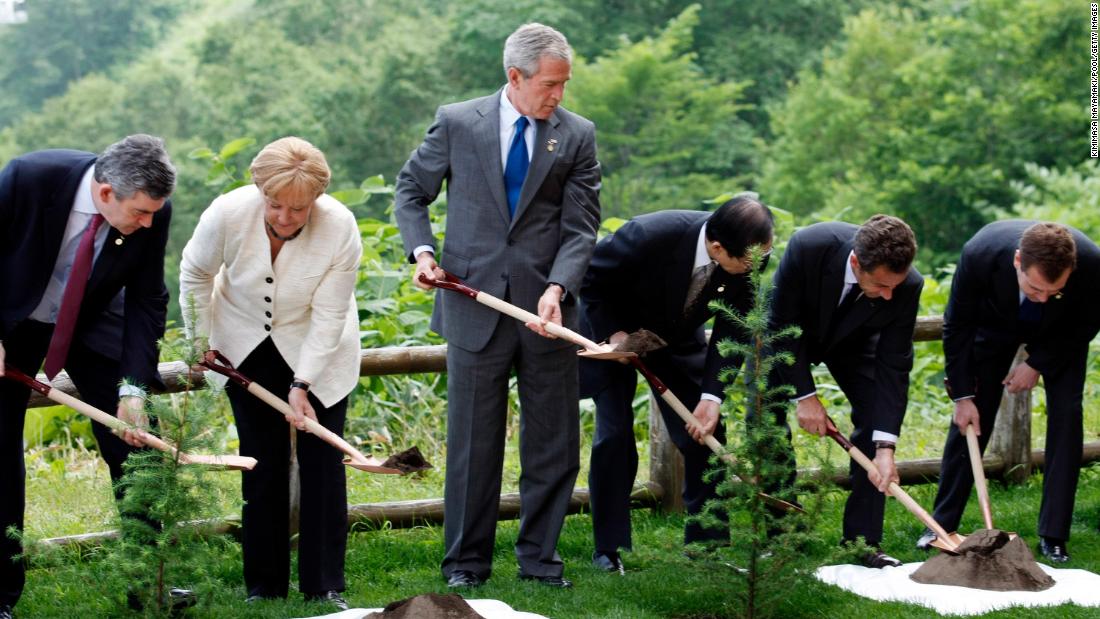 Bush and other world leaders plant a memorial tree after a working session at the G8 summit in Toyako, Japan, in June 2008.