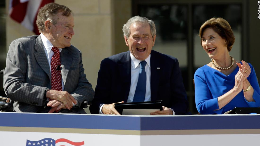 Bush, his wife and his father attend the dedication of his presidential library near Dallas in 2013.