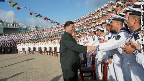 Chinese President Xi Jinping, meets with representatives of the aircraft carrier unit and the manufacturer at a naval port in Sanya, south China&#39;s Hainan province on Dec. 17, 2019.