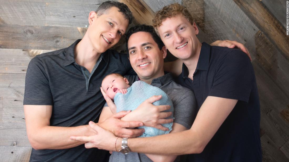 Three dads, a baby and the legal battle to get their names added to a birth certificate image