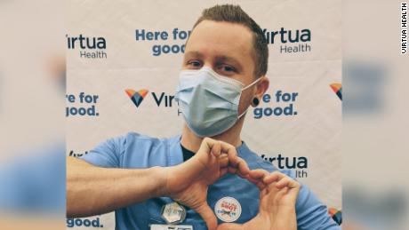 Skyler Fehnel, radiology technologist at Virtua Health, stopped for a photo after receiving the COVID-19 vaccine at Virtua's vaccination clinic for its employees in Voorhees, New Jersey. 