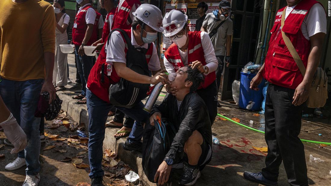 Medics help supply oxygen to a protester who was exposed to tear gas in Yangon on March 3.