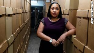 Fulton County District Attorney Fani Willis poses among boxes containing thousands of primal cases at her office, Wednesday, February 24, 2021, in Atlanta.