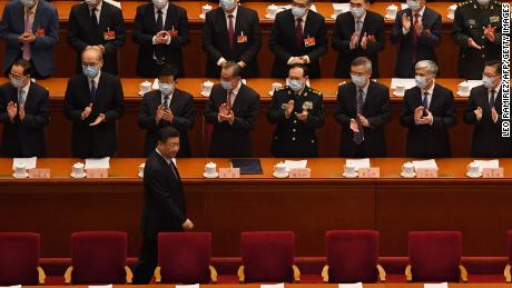 Delegates applaud as Chinese President Xi Jinping arrives for the opening ceremony of the Chinese People&#39;s Political Consultative Conference (CPPCC) at the Great Hall of the People in Beijing on March 4.