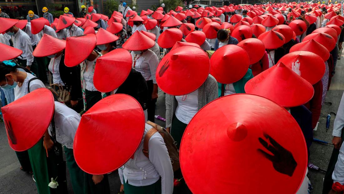 Schoolteachers wear traditional hats while participating in an anti-coup demonstration in Mandalay on March 3.