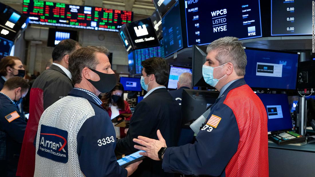 Dow soars more than 570 points in topsy-turvy trading after solid jobs report