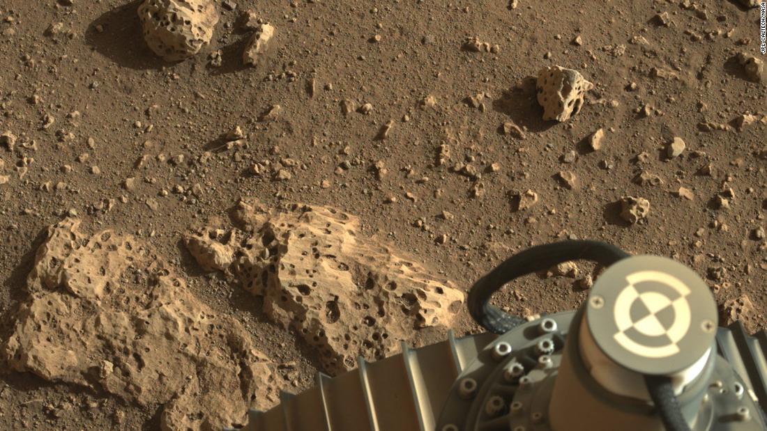 This image shows the rover&#39;s wheel on the surface of the red planet.