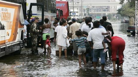 Evacuees board buses in New Orleans on September 1, 2005, after Hurricane Katrina hit. Years later, the devastation continues, according to Lori Peek, director of the Natural Hazards Center. &quot;Following low-income African American kids...today, that storm is not over in their life,&quot; she says.