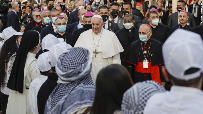 Pope Francis arrives to officiate mass with other priests at the Chaldean Cathedral of Saint Joseph in Baghdad on Saturday, March 6.