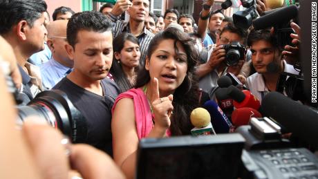 Sobhraj's wife, Nihita Biswas, speaks with media outside the Supreme Court in Kathmandu on July 30, 2010. 