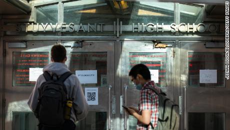 Students arrive at Stuyvesant High School in New York City in October.