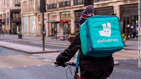 A Deliveroo rider delivering takeaway food  in central London.