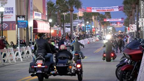 People congregate on Main Street at Bike Week festivities in Daytona Beach, Florida, on Monday.