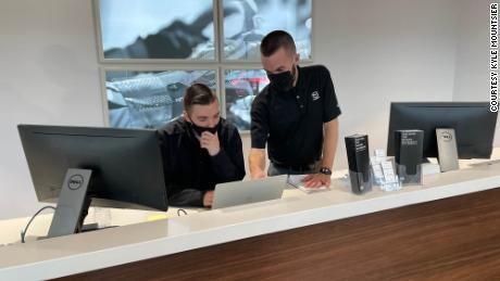 Online sales have dramatically changed business for Kyle Mountsier (standing), the marketing and business development director for Nelson Mazda in Franklin, Tennessee, who is seen here with team leader Tanner Hostetter.