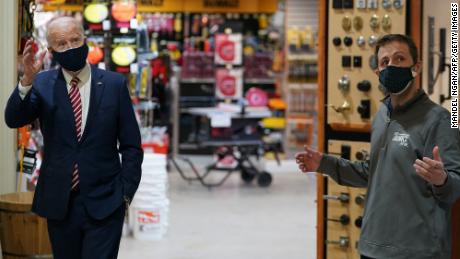 US President Joe Biden (L) visits W.S. Jenks &amp; Son, a hardware store that has benefited from a Paycheck Protection Program (PPP) loan, in Washington, DC, on March 9, 2021. - Biden met with Michael Siegel (R), co-owner of W.S. Jenks &amp; Son, and Mary Anna Ackley, owner of Little Wild Things Farm, a business next door to Jenks &amp; Son which also benefited from the PPP. (Photo by Mandel Ngan/AFP/Getty Images)