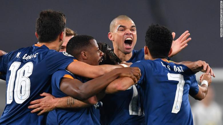 Oliveira celebrates with teammates after scoring their side&#39;s second goal against Juventus.