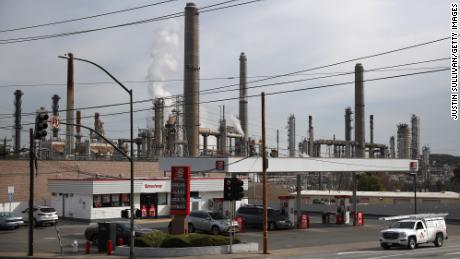 A car drives by a Speedway gas station next to the Shell refinery on March 03, 2021 in Martinez, California. Gas prices have increased across the United States to a national average of $2.72 per gallon, an increase of 30 cents from one month ago. Gas in California has an average price of $3.68 per gallon, the highest in the nation.  (Photo by Justin Sullivan/Getty Images)