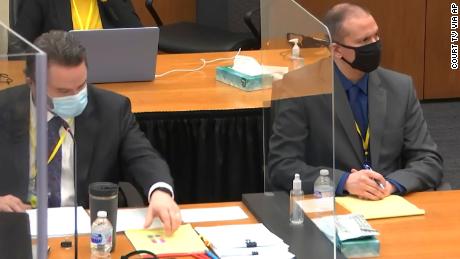 In this screen grab from video, defense attorney Eric Nelson, left, and former Minneapolis police officer Derek Chauvin listen in court during jury selection on Wednesday.