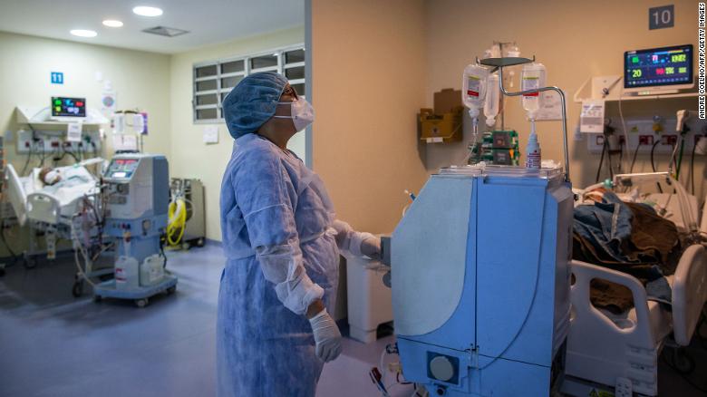 A health worker cares for a COVID-19 patient at an Intensive Care Unit (ICU) of the Ronaldo Gazolla Public Municipal Hospital in Rio de Janeiro, Brazil, on March 5, 2021.