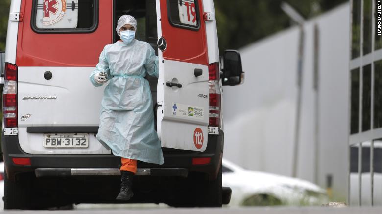 A healthcare worker arrives in an ambulance bringing a patient to HRAN Hospital in Brasilia, Brazil on March 8.