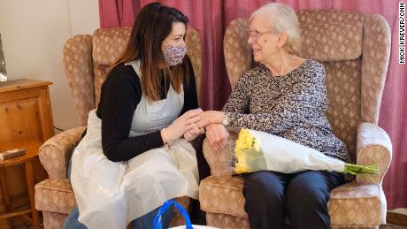 Sara Agliata visits her grandmother Renee Dolan at a care home in Bexhill, England.