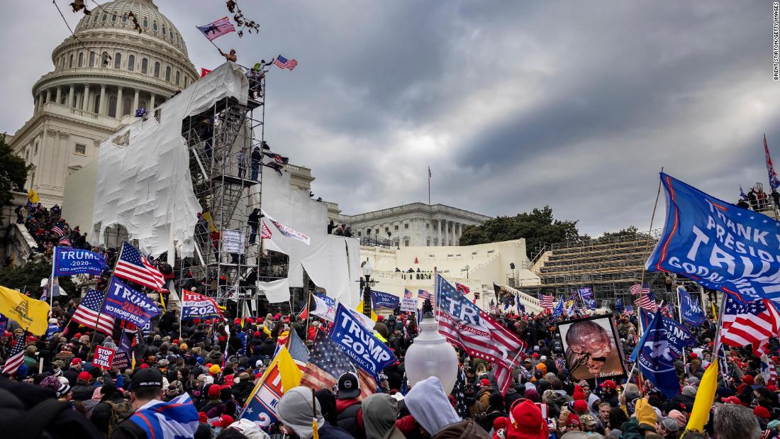 Mother of police officer injured in Capitol riot says she's outraged by Trump's lie that his supporters were 'hugging and kissing' cops during attack