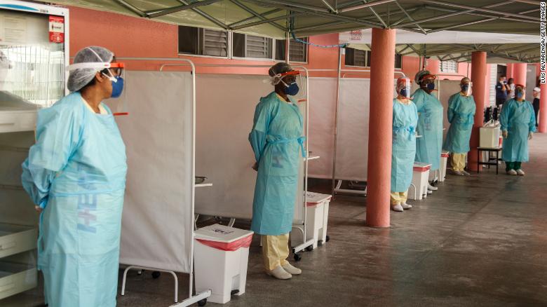 Health workers from the Alberto Torres hospital wearing PPE on December 4, 2020 in Sao Goncalo, Brazil. 