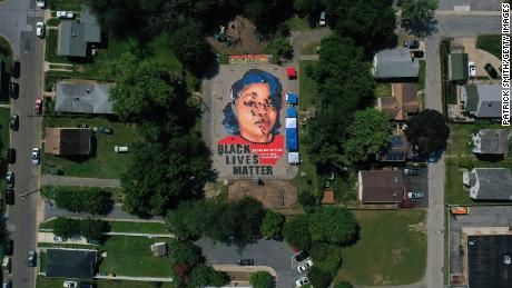 In an aerial view from a drone, a large-scale ground mural depicting Breonna Taylor with the text &quot;Black Lives Matter&quot; is seen being painted at Chambers Park on July 5, 2020 in Annapolis, Maryland.