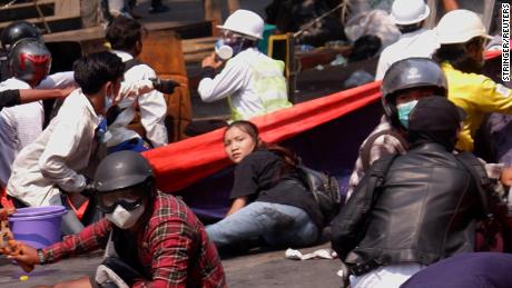 Angel lies on the ground before she was shot in the head as Myanmar&#39;s forces opened fire to disperse an anti-coup demonstration in Mandalay, on March 3.