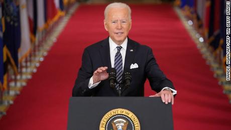 US President Joe Biden gestures as he speaks on the anniversary of the start of the Covid-19 pandemic, in the East Room of the White House in Washington, DC on March 11, 2021. (Photo by MANDEL NGAN / AFP) (Photo by MANDEL NGAN/AFP via Getty Images)