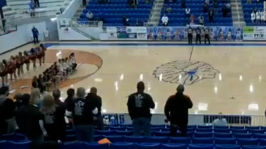 An announcer hurled racist insults at a high school basketball team for kneeling during the National Anthem